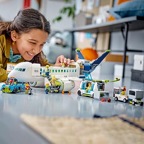 LEGO City Passenger Airplane Building Toy Set with Large Airplane, Passenger Bus, Luggage Truck, Container Loader, and 9 Minifigures C595